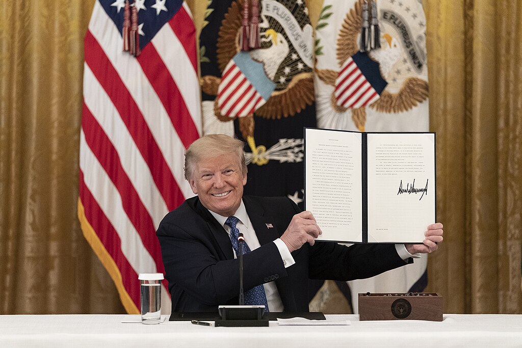 Donald Trump signing executive orders affecting U.S. immigration or education