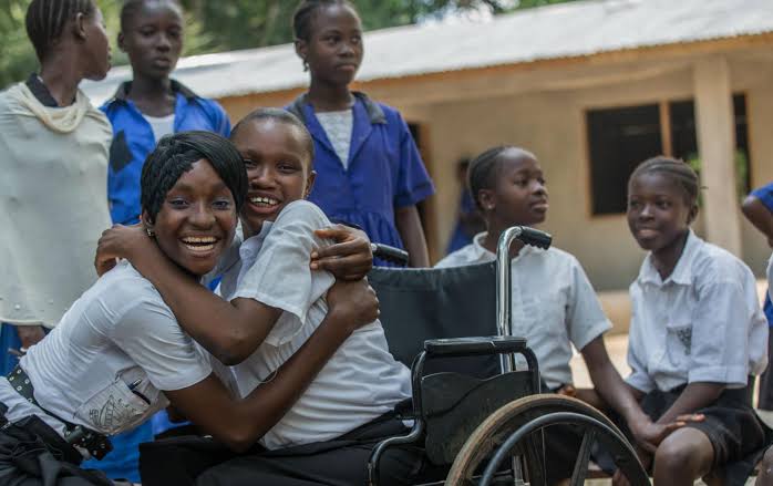 Nigerian students with and without disabilities in a classroom participating in inclusive learning