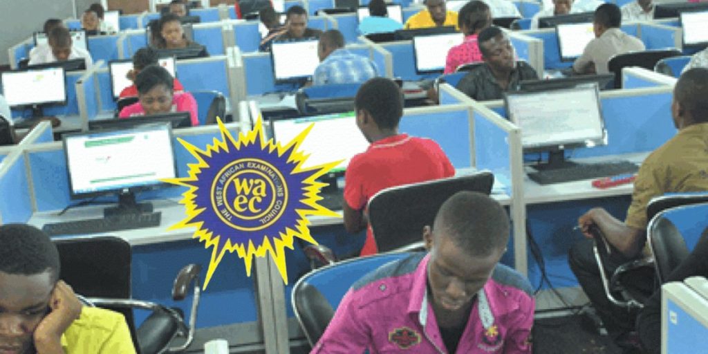 Students sitting at desktop computers during a CBT exam in a public secondary school