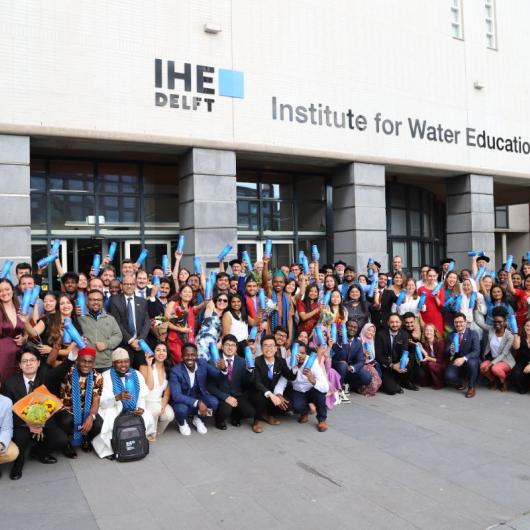 "Cohort of Erasmus Mundus students at European university campus."