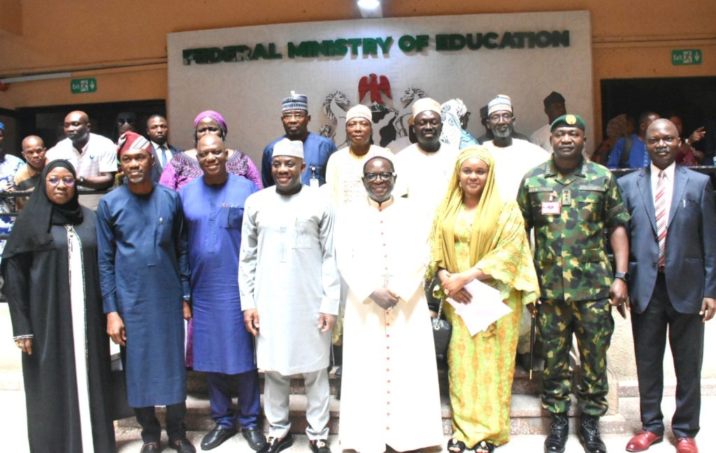 “Dr Tunji Alausa presenting letters to new Governing Council members in Abuja.”