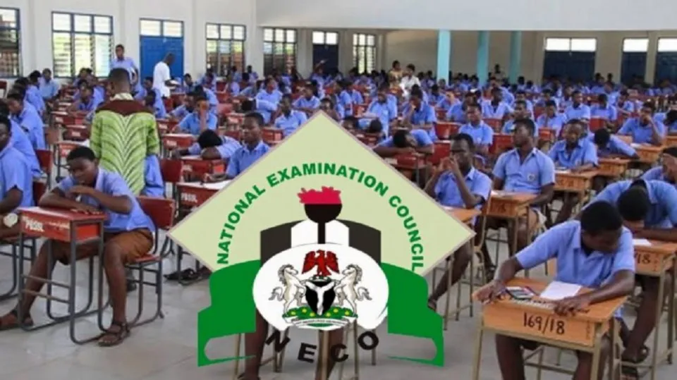 Students in uniform writing the 2025 NECO BECE in an examination hall