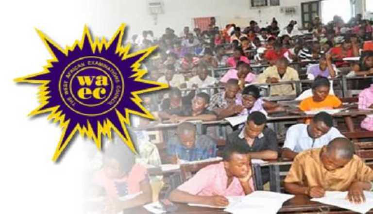 Nigerian students writing the 2025 WASSCE English paper late into the night