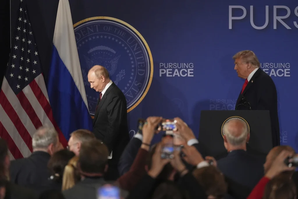 Donald Trump and Vladimir Putin shake hands during Alaska Summit 2025