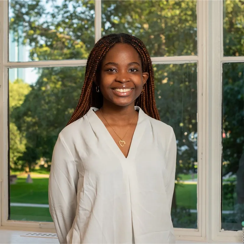 Nigerian teenage math genius Faith Odunsi smiling after winning the Global Open Mathematics competition