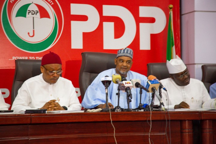 PDP convention banner in Ibadan with party logo and delegates setting up