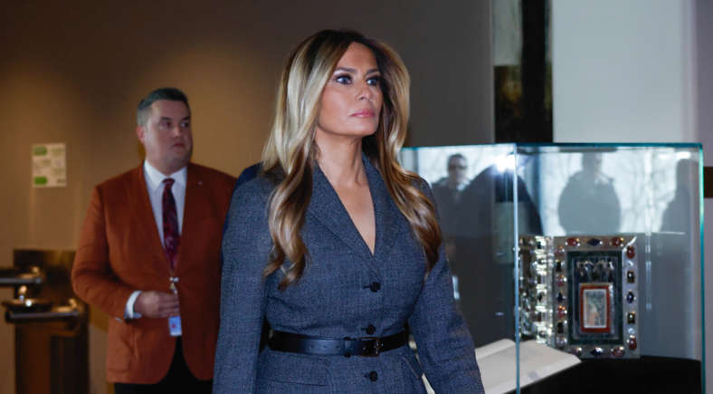 Historical portraits of prominent US First Ladies looking serious inside the White House.