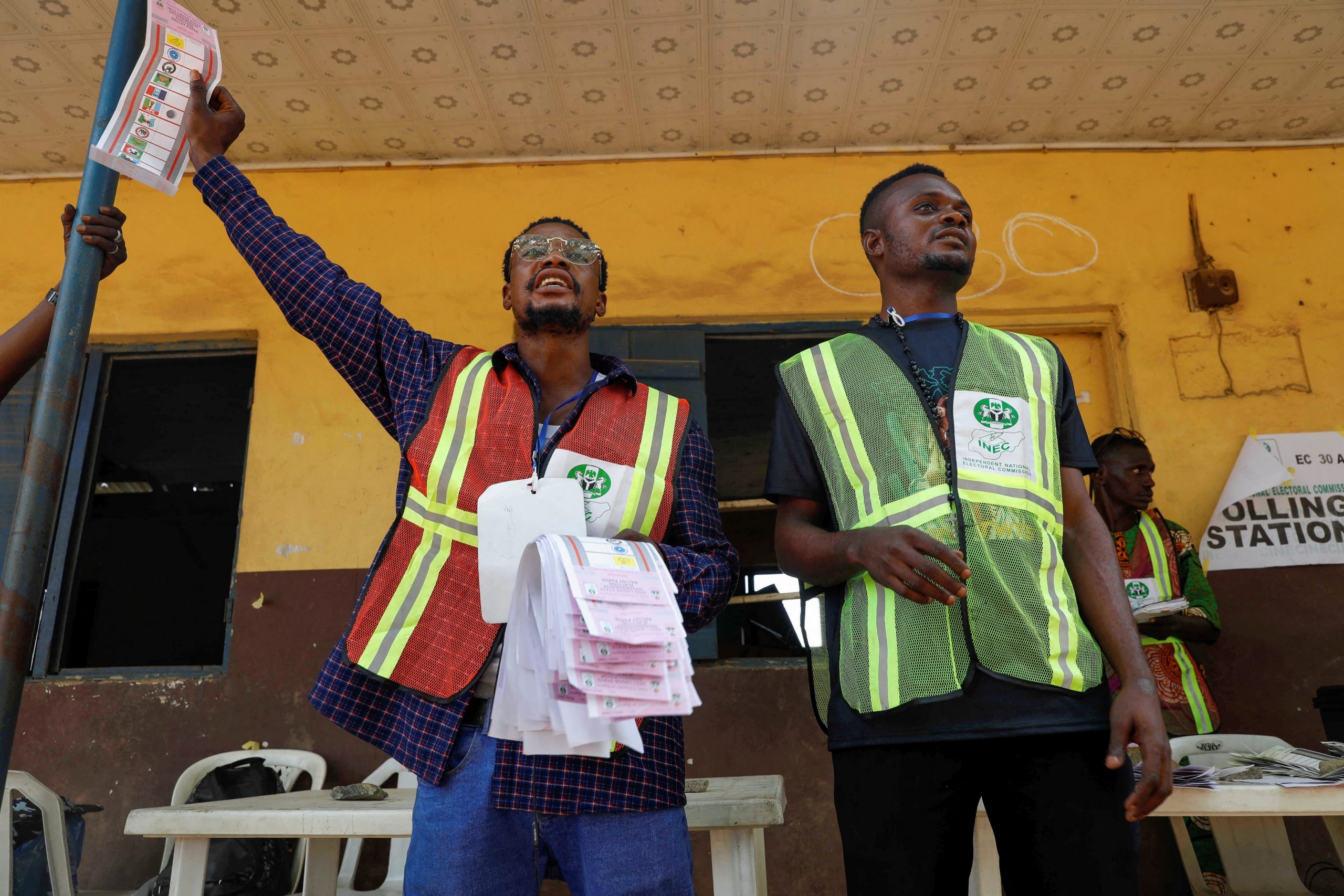 INEC officials managing polling materials during the electoral process., AI generated
