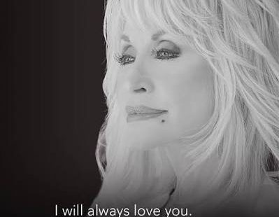 Country music icon Dolly Parton performing on stage.