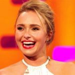 Actress Hayden Panettiere smiling at a Hollywood red carpet event.