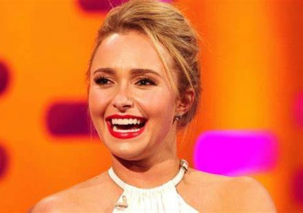 Actress Hayden Panettiere smiling at a Hollywood red carpet event.