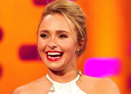 Actress Hayden Panettiere smiling at a Hollywood red carpet event.