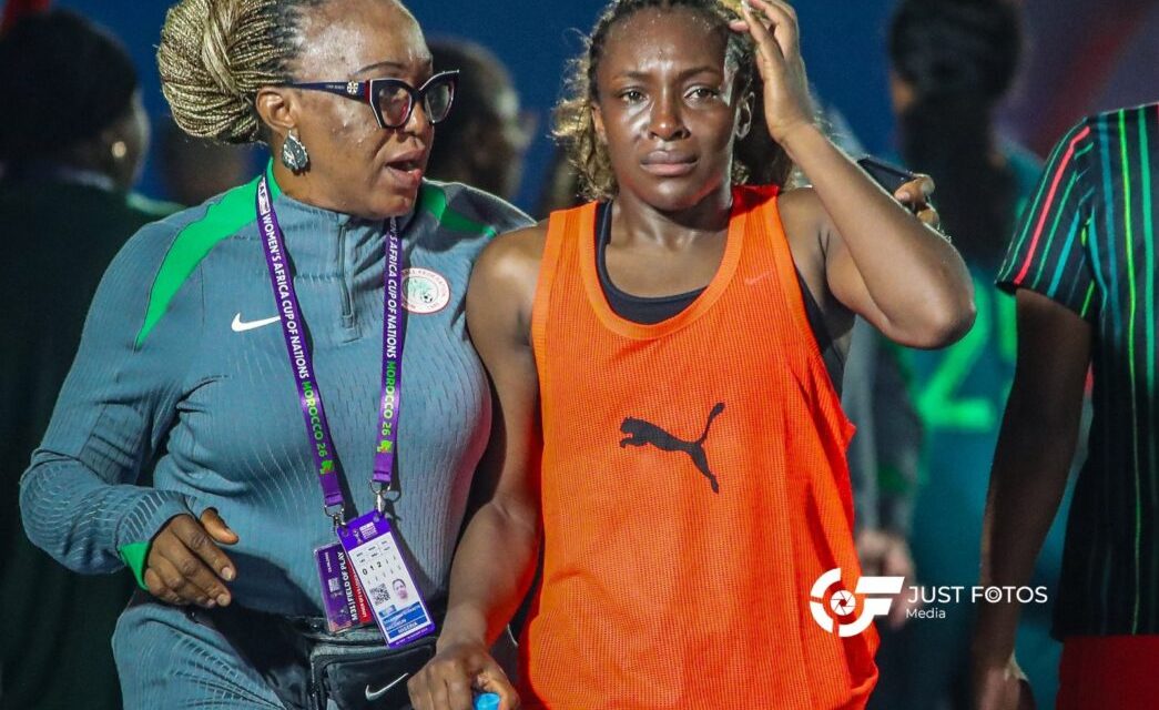 Super Falcons players looking disappointed on the pitch after loss to South Africa.