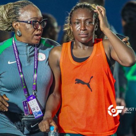Super Falcons players looking disappointed on the pitch after loss to South Africa.