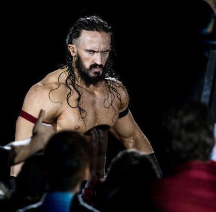 Wrestler Benjamin Satterley, known as Pac, in the ring during an AEW event.