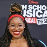 Carla Jeffery smiling at a red carpet event.