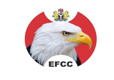 EFCC Chairman Ola Olukoyede speaking at a press conference alongside digital cryptocurrency icons.